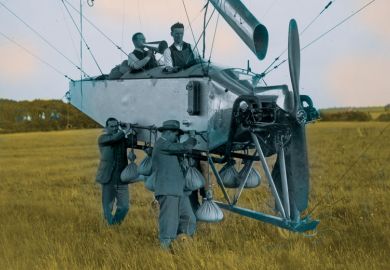 Man with a megaphone on an airship being carried by two men as a metaphor for We must be free to soar over disciplinary borders