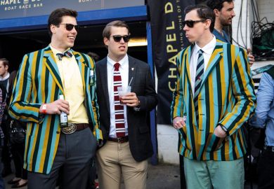 Spectators wearing boating blazers gather during the annual Boat Race between Oxford and Cambridge University to illustrate rooting out elites’ influence