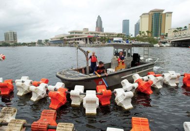 Coast Guards set up "water barriers" to restrict access under bridges near the Tampa Bay  Coast Guards set up "water barriers" to restrict access under bridges near the Tampa Bay to illustrate US set to impose limits on China’s Thousand Talents programme