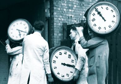 Workers carrying large clocks as Traditional three-hour university exams may soon be a thing of the past as leading UK institutions eye a switch to online and more “authentic” forms of assessment 