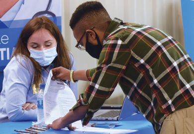 Person at a job fair as a metaphor for NIH funds cluster hiring of ethnic minority  scientists