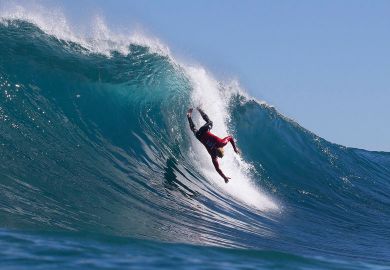 surfer falling from a wave  surfer falling from a wave to illustrate Top universities’ overseas income boost wiped out by inflation