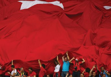 Fans of Turkey roll out the Turkish flag in support of their team Fans of Turkey roll out the Turkish flag in support of their team