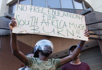 :Students stage a protest over government's plan of increasing university tuition feesi in front of the Parliament building in Cape Town, South Africa :Students stage a protest over government's plan of increasing university tuition feesi in front of the Parliament building in Cape Town, South Africa