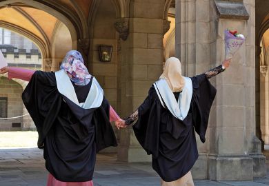  Malaysian students wearing gowns at their Melbourne University graduation to illustrate International students ‘becoming happier’ than locals: surveys