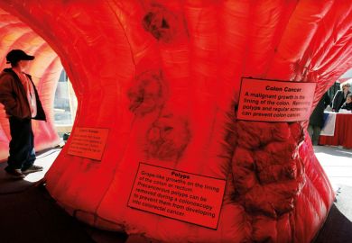 A boy stands inside an interactive replica of a human colon Boy stands inside an interactive replica of a human colon to illustrate Funding and careers structures are holdi ng back early cancer detection