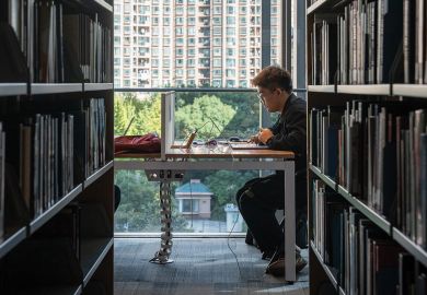 A student studies in the library at the New York University Shanghai campus, China. A student studies in the library at the New York University Shanghai campus, China.