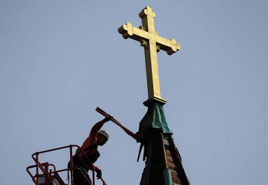 Workers began the process of removing the steeple of the Faith Lutheran Church to illustrate Doubts over future for US’ Christian colleges amid closures