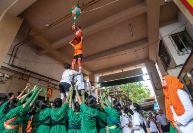 Students of Shreemati Nathibai Damodar Thackersey (SNDT) college form a human pyramid to illustrate Shift to Indian enrolment brings new challenges for US colleges