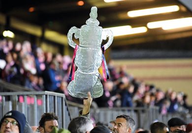 A foil replica FA Cup is held up high at Champion Hill in London to illustrate Degree apprenticeships: ‘don’t ruin something world is adopting’