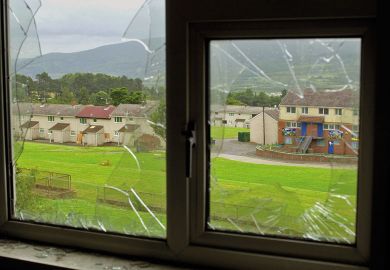 Urban decay UK view through a smashed window to illustrate Researching violence on your own turf can be a slap in the face