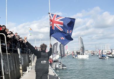 New Zealand's skipper Conrad Colman, holding a New Zealand national flag, greets supporters after he arrived Man, holding a New Zealand national flag, greeting supporters to illustrate Branch campuses ‘not the way forward’ for New Zealand