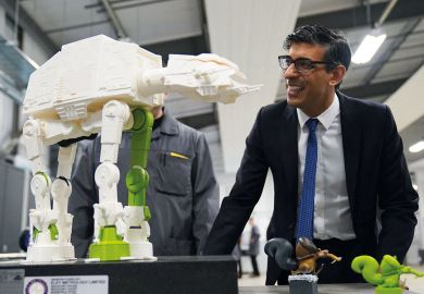 Prime Minister Rishi Sunak looks at a 3-D printed model of an All Terrain Armoured Transport Walker to illustrate Horizon association deal ‘opens door for Pioneer reappraisal’