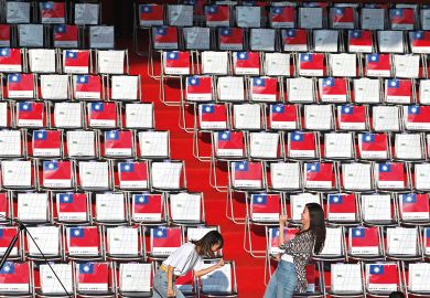 Two people in front of empty seating in Taiwan Two people in front of empty seating in Taiwan to illustrate Scholars doubtful of Taiwan’s international student target