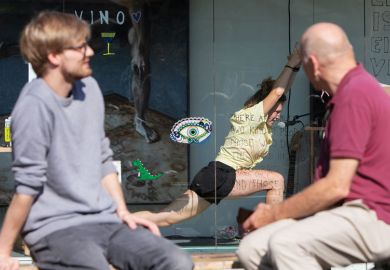 Two people watching an artist doing yoga in a container