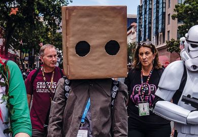 Person dressed with a large cardboard box covering his head Person dressed with a large cardboard box covering his head to illustrate 2U’s edtech ethics submission criticised