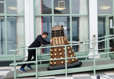 A man pushes a Dalek up a ramp in  Scarborough to illustrate UK research ‘smashed’ by US and China in key areas