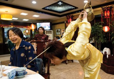 A martial arts master serves tea in a traditional teahouse to illustrate UK’s China expertise ‘needs more student demand’ to thrive