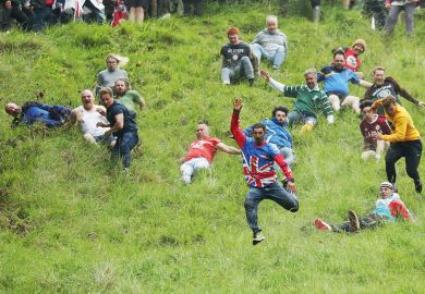 People taking part in the Cheese-Rolling downhill race in Gloucester, England People taking part in the Cheese-Rolling downhill race in Gloucester, England to illustrate Entry rate fall creates ‘strategic uncertainty’ in English sector