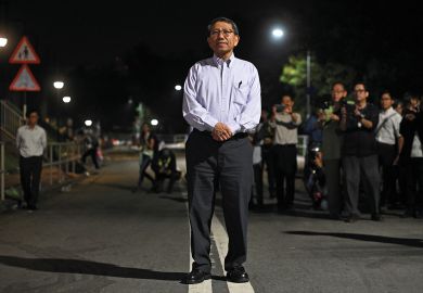 Rocky Tuan, vice chancellor of the Chinese University of Hong Kong (CUHK), poses during a photo call for the press as he arrives to meet students and protesters after police fired tear gas earlier during clashes with protesters on campus Rocky Tuan, vice chancellor of the Chinese University of Hong Kong (CUHK), poses during a photo call for the press as he arrives to meet students and protesters after police fired tear gas earlier during clashes with protesters on campus