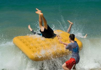 Boys fall off inflatable raft into sea
