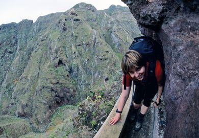 lady tight path smiling_climb_rocks getty.jpg lady tight path smiling_climb_rocks getty.jpg