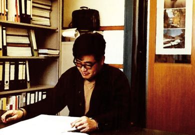 Weimin Wu at work in office, Switzerland