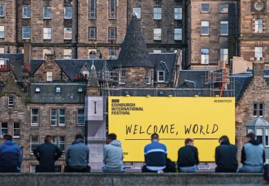 EDINBURGH, SCOTLAND - AUGUST 14: Citizen stand in front of the welcome sign of Edinburgh Festival Fringe on August 14, 2016 in Edinburgh, Scotland. EDINBURGH, SCOTLAND - AUGUST 14: Citizen stand in front of the welcome sign of Edinburgh Festival Fringe on August 14, 2016 in Edinburgh, Scotland.