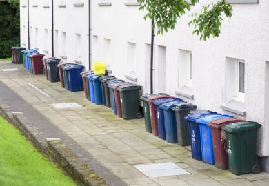 A row of wheelie bins, symbolising quality over quantity