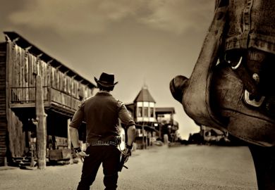 A cowboy enters a Wild West town 