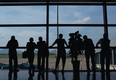 People standing at a window