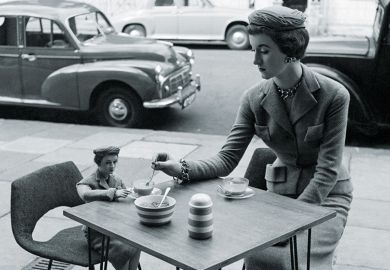 Woman sitting at a cafe with her miniature