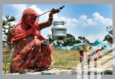 A lady collecting drinking water from an almost dried up well as others come to collect at Padal village of Samba district, around 40 kilometer from Jammu, India. A lady collecting drinking water from an almost dried up well as others come to collect at Padal village of Samba district, around 40 kilometer from Jammu, India.