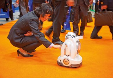 Woman interacting with robot
