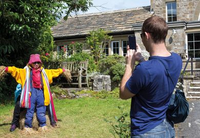 Woman pretends to be a scarecrow Woman pretends to be a scarecrow