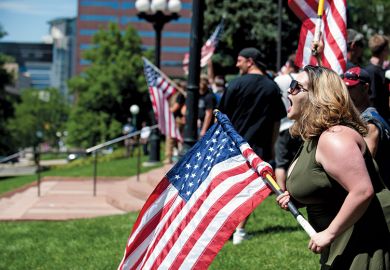 Woman shouting with American flag