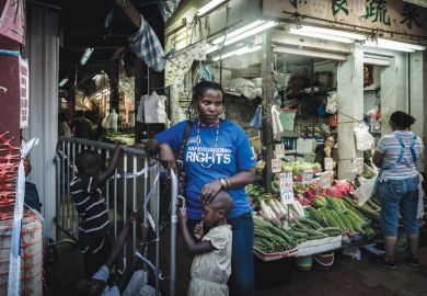 Woman standing with her children, Hong Kong