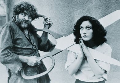 Woman with giant scissors round her neck