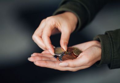 Woman counting euros in hand