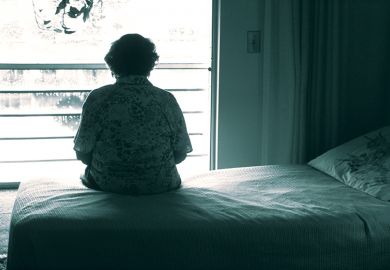 Woman sitting on a bed
