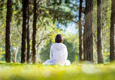Woman relaxingly practicing meditation