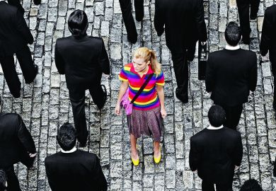Young woman in a crowd of people in black suits illustrating feature article about US undergraduate university system