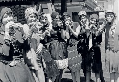 Women eating hot dogs