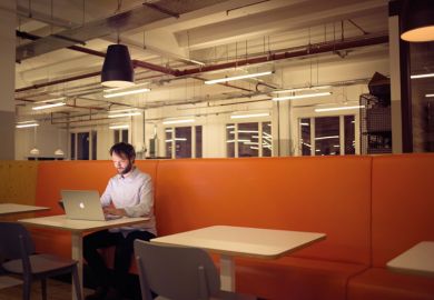Man working on laptop alone Man working on laptop alone