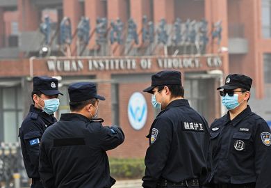 Security personnel stand guard outside the Wuhan Institute of Virology as members of the World Health Organization team investigating the origins of Covid-19 visit the institute Security personnel stand guard outside the Wuhan Institute of Virology as members of the World Health Organization team investigating the origins of Covid-19 visit the institute
