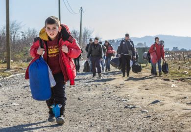 Young boy leads caravan of Syrian refugees