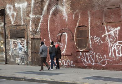 Young people walk in rundown neighbourhood Young people walk in rundown neighbourhood