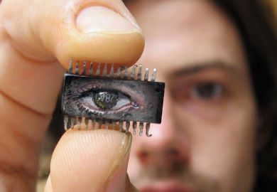 Yuri Zupancic holding microchip painting Yuri Zupancic holding microchip painting