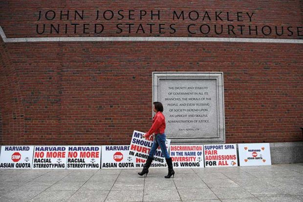 woman-walking-past-signs woman-walking-past-signs