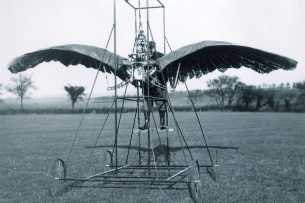 A man inside a winged contraption